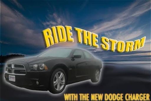 Black Dodge Charger on a stormy road with text “Ride the Storm” and “With the new Dodge Charger.”