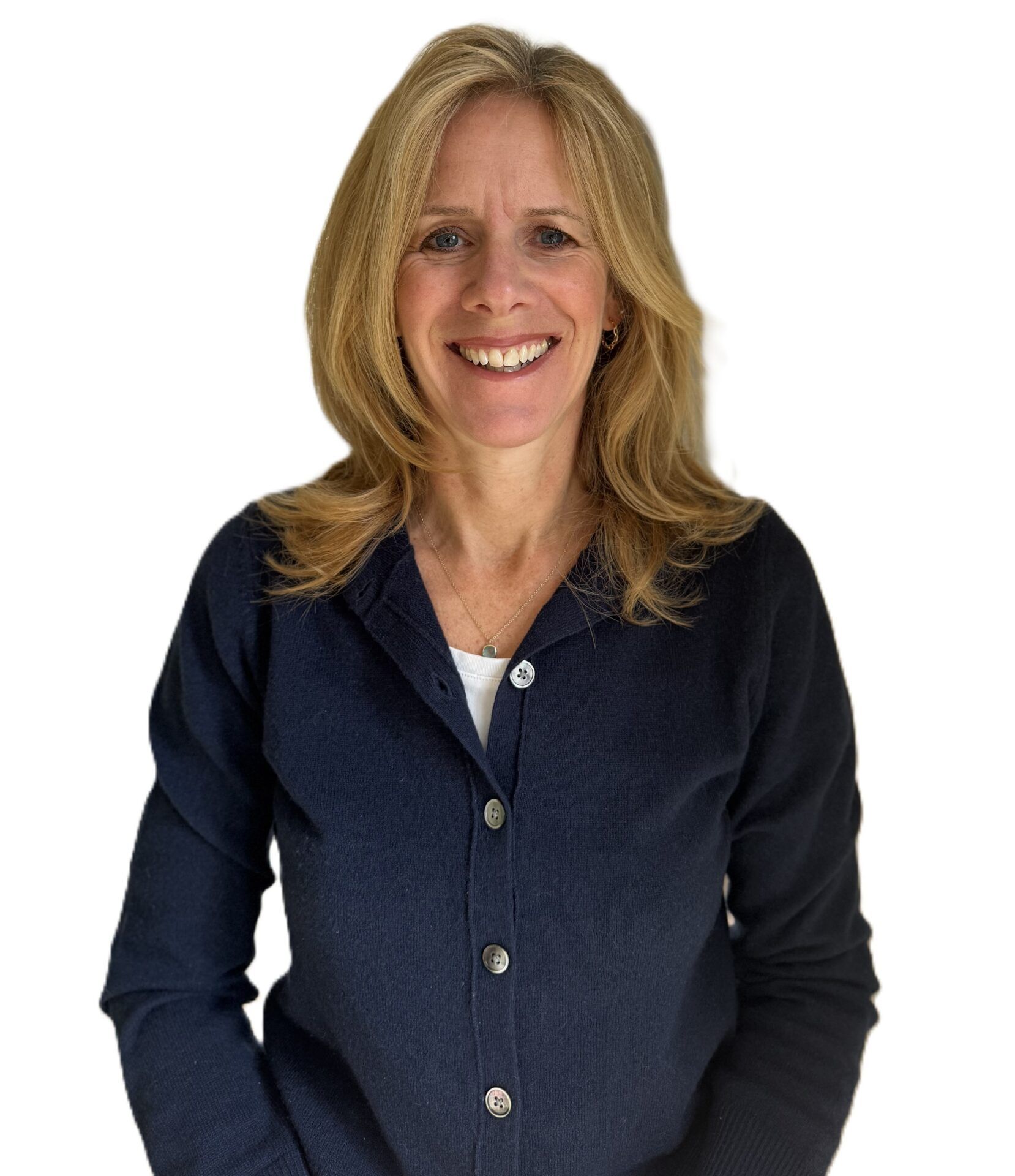 Smiling woman in a navy blazer against a plain white background