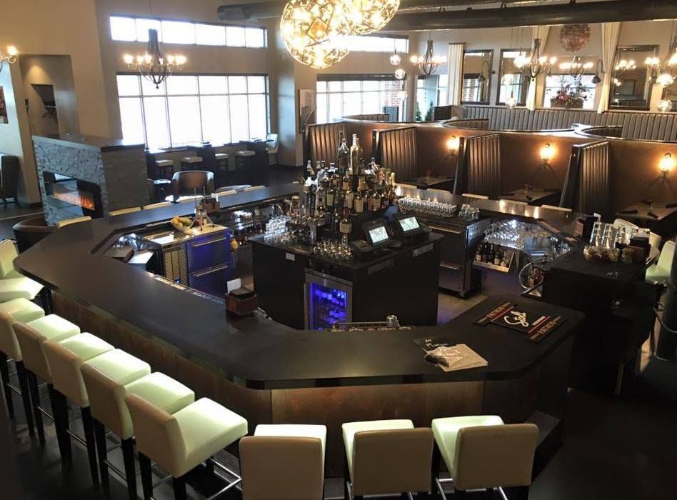 An aerial view of a restaurant with a bar and stools