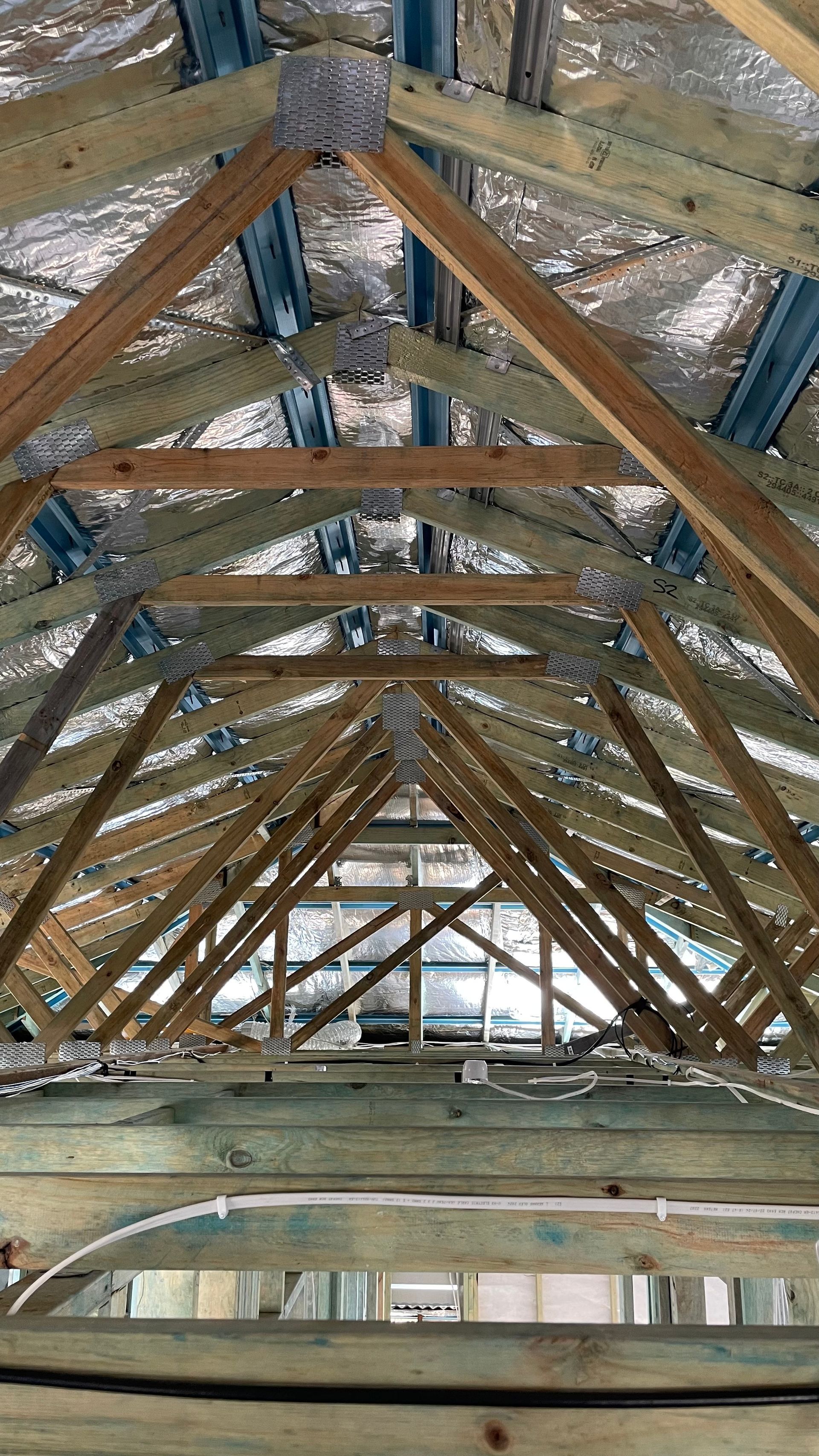 Looking up at the roof of a building under construction.
