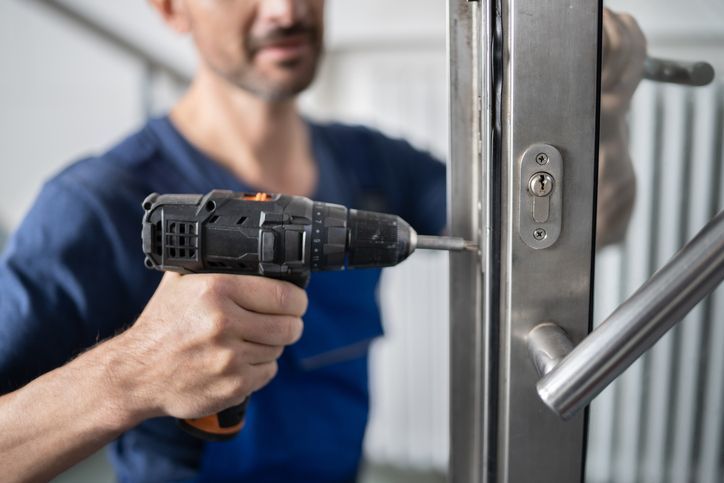 Handyman Fitting A New Door