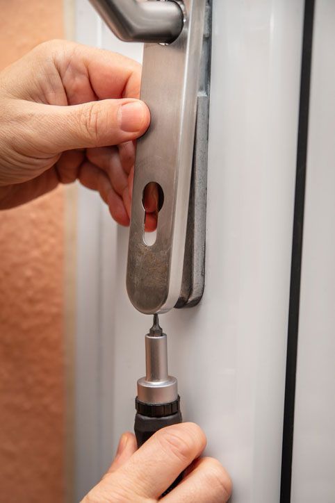 Craftsman uninstalling a panel or door mounting, maybe key escutcheon