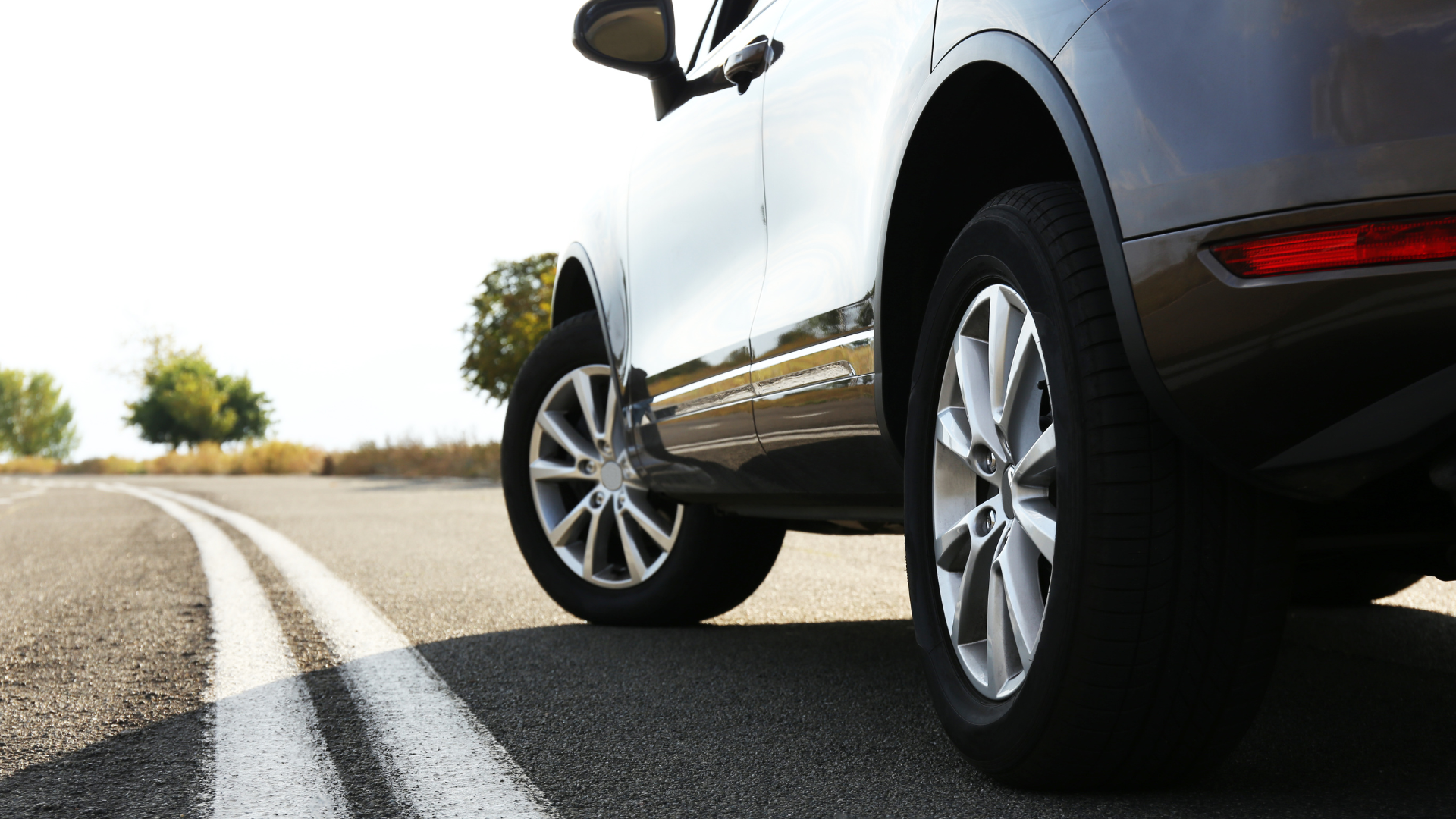 A car is parked on the side of the road.