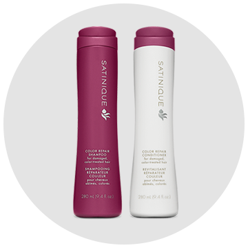 Two bottles of satinique shampoo and conditioner on a white background
