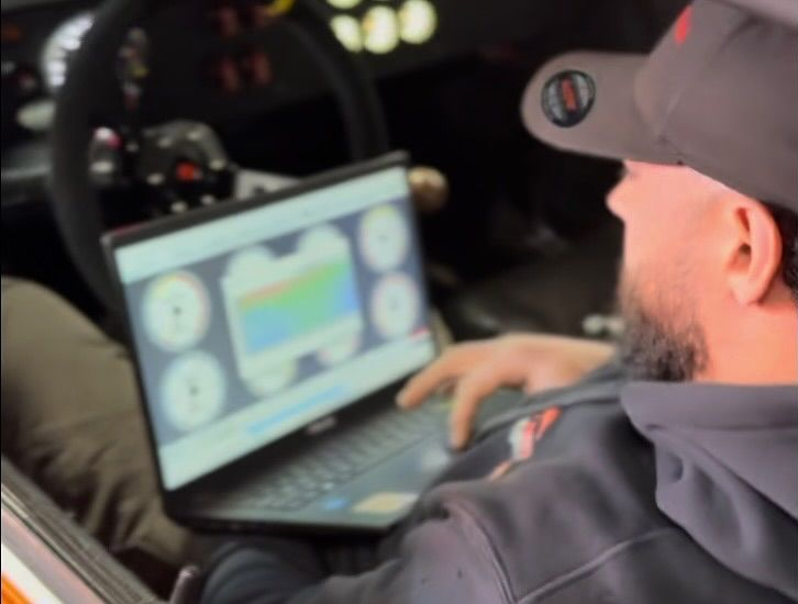 Technician Using Diagnostic Laptop For Vehicle Tuning | MLV Motoring