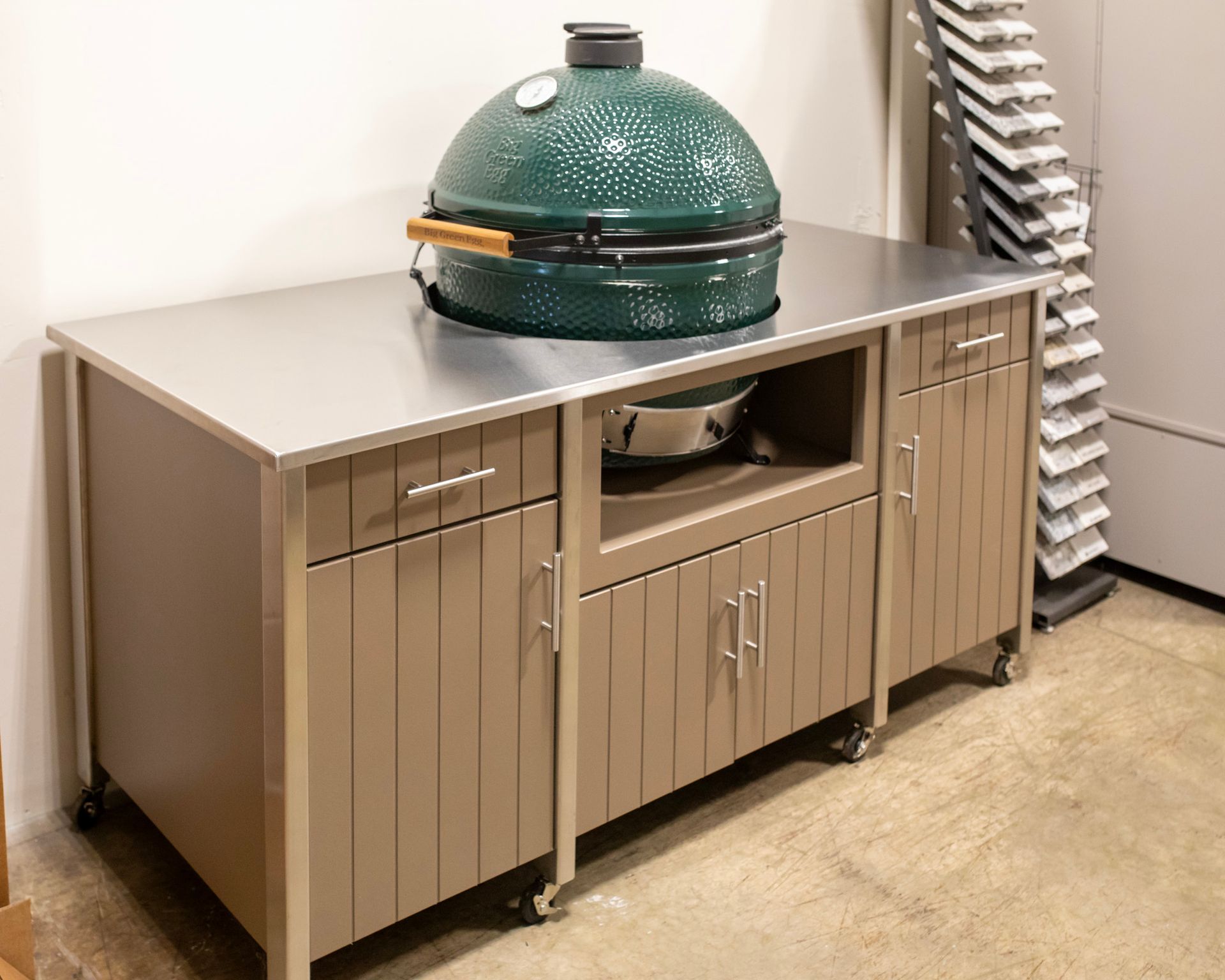 Green ceramic grill on beige storage cabinet in a room
