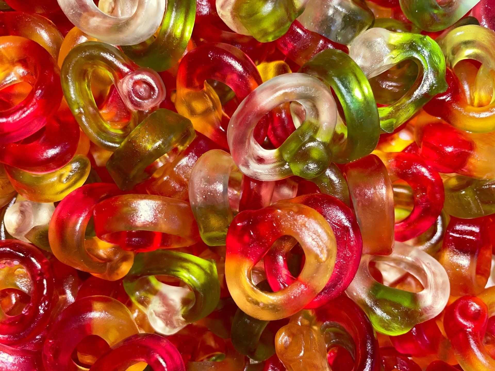 A close up of a pile of colorful gummy bears