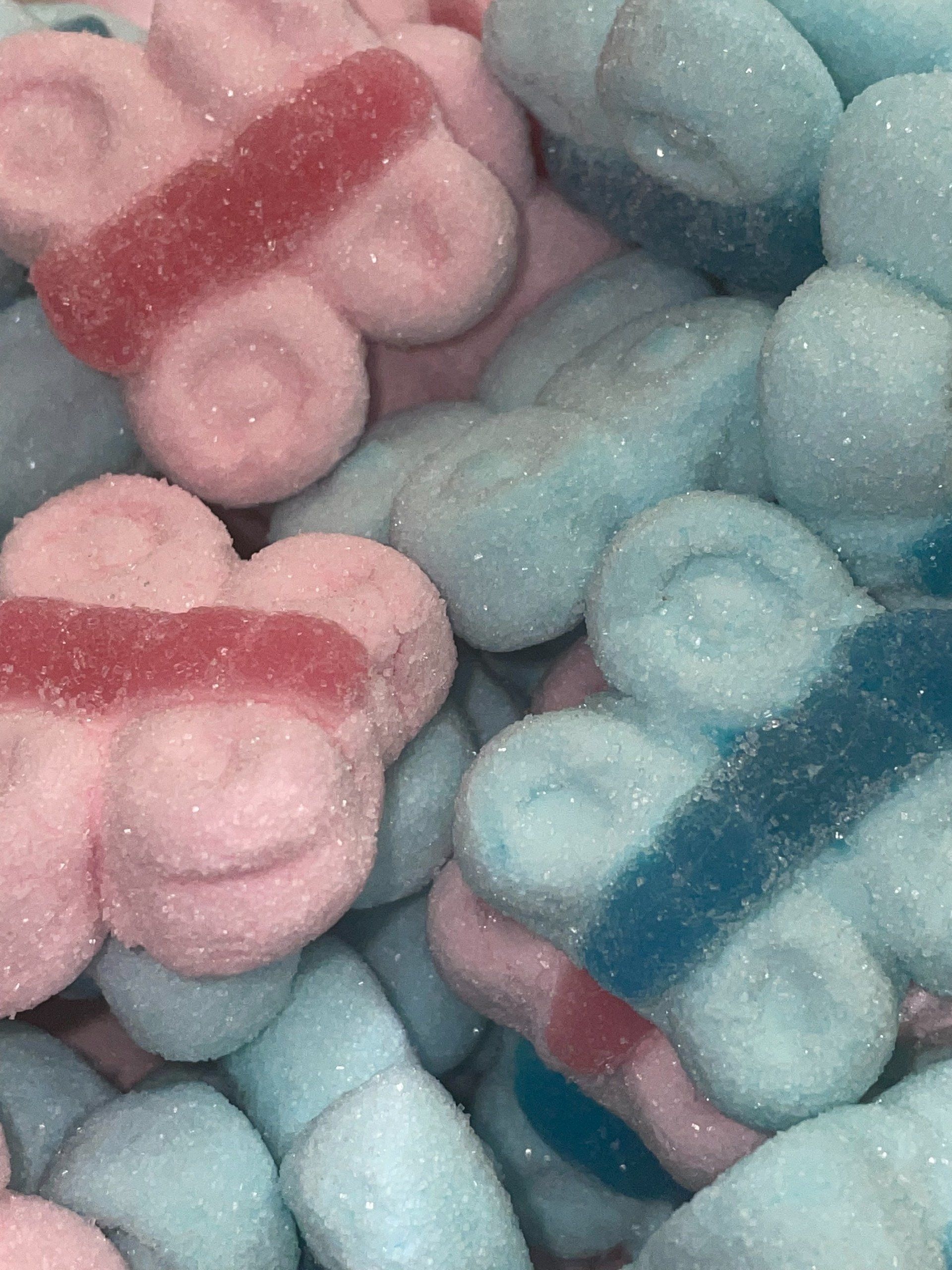A pile of pink and blue candy in the shape of butterflies.