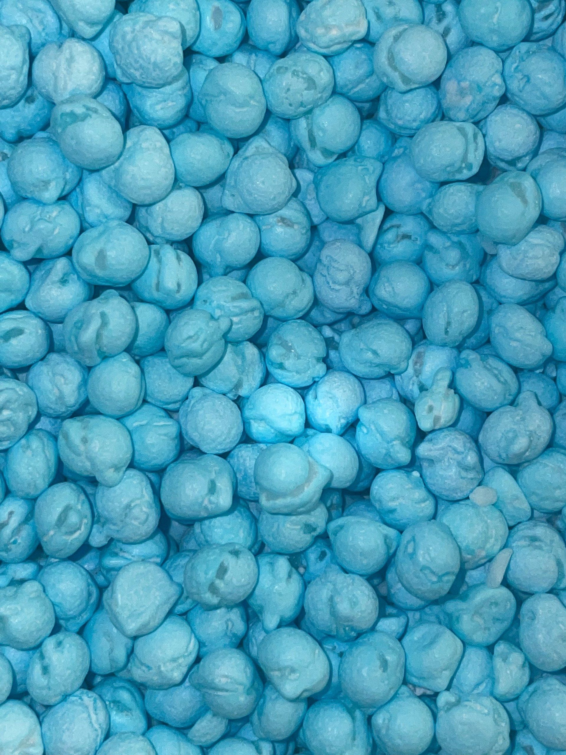 A close up of a pile of blue popcorn.