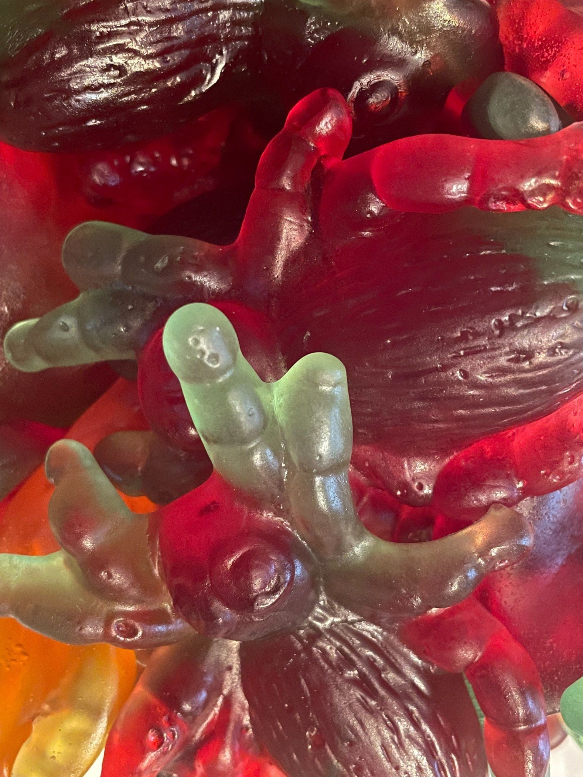 A close up of a pile of gummy octopus candy