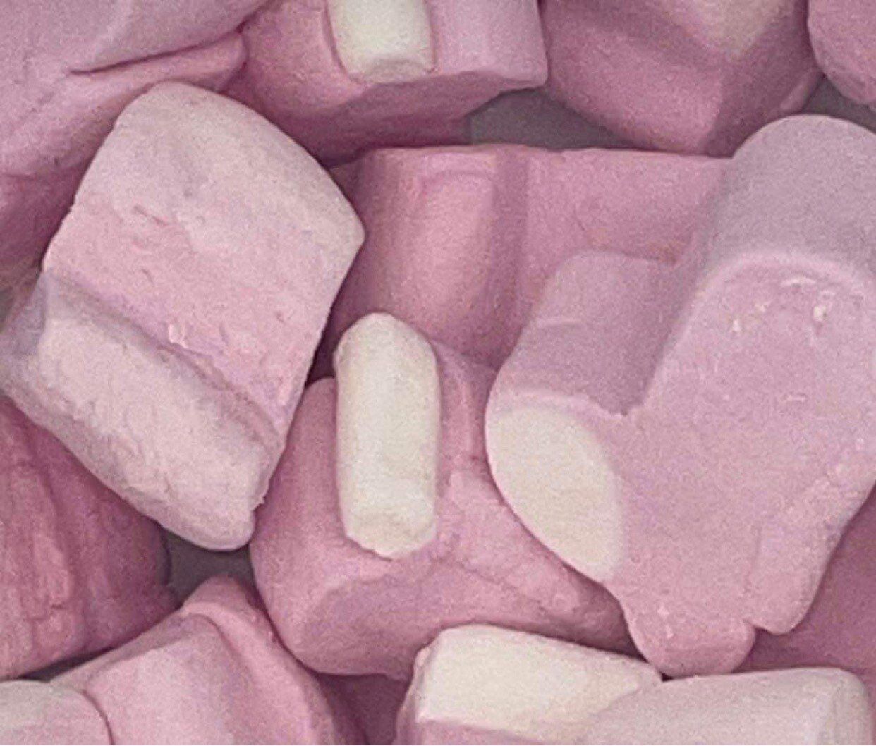 A pile of pink and white marshmallows in the shape of hearts.