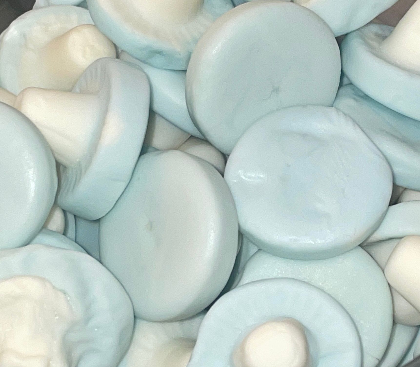 A pile of blue and white mushrooms on a table