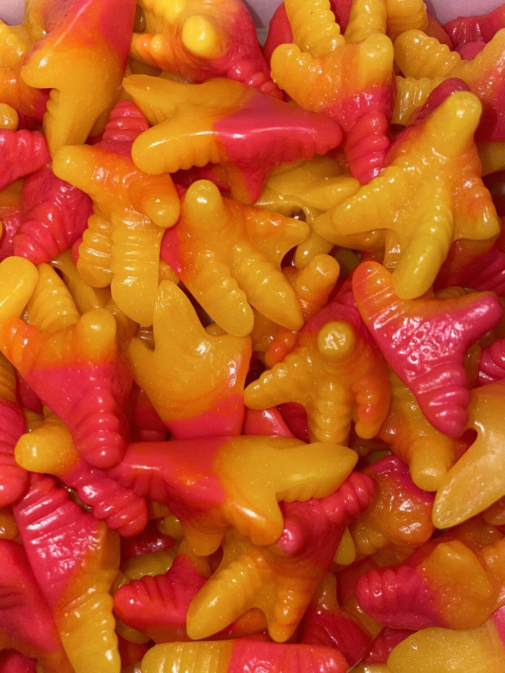 A close up of a pile of gummy chicken feet.