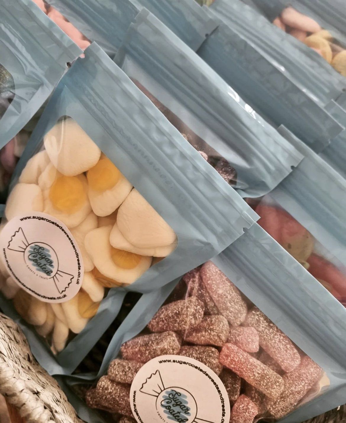 A bunch of bags of candy are stacked on top of each other