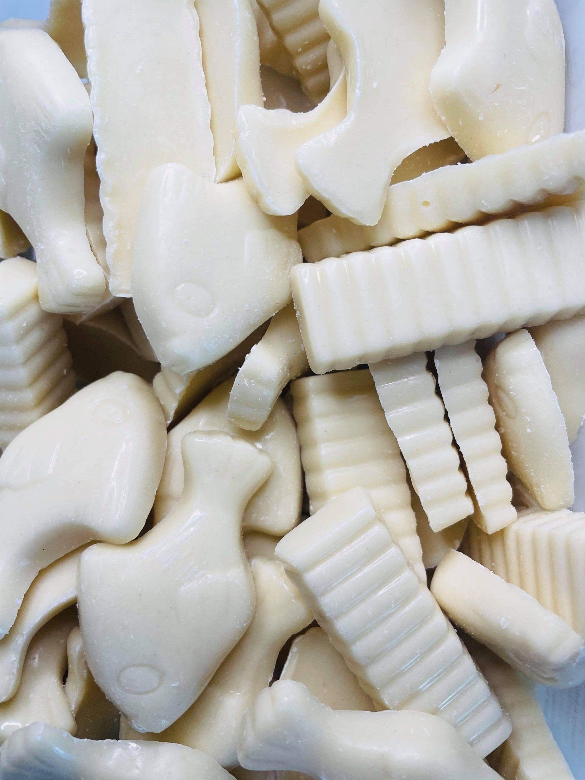 A pile of white candy in the shape of animals