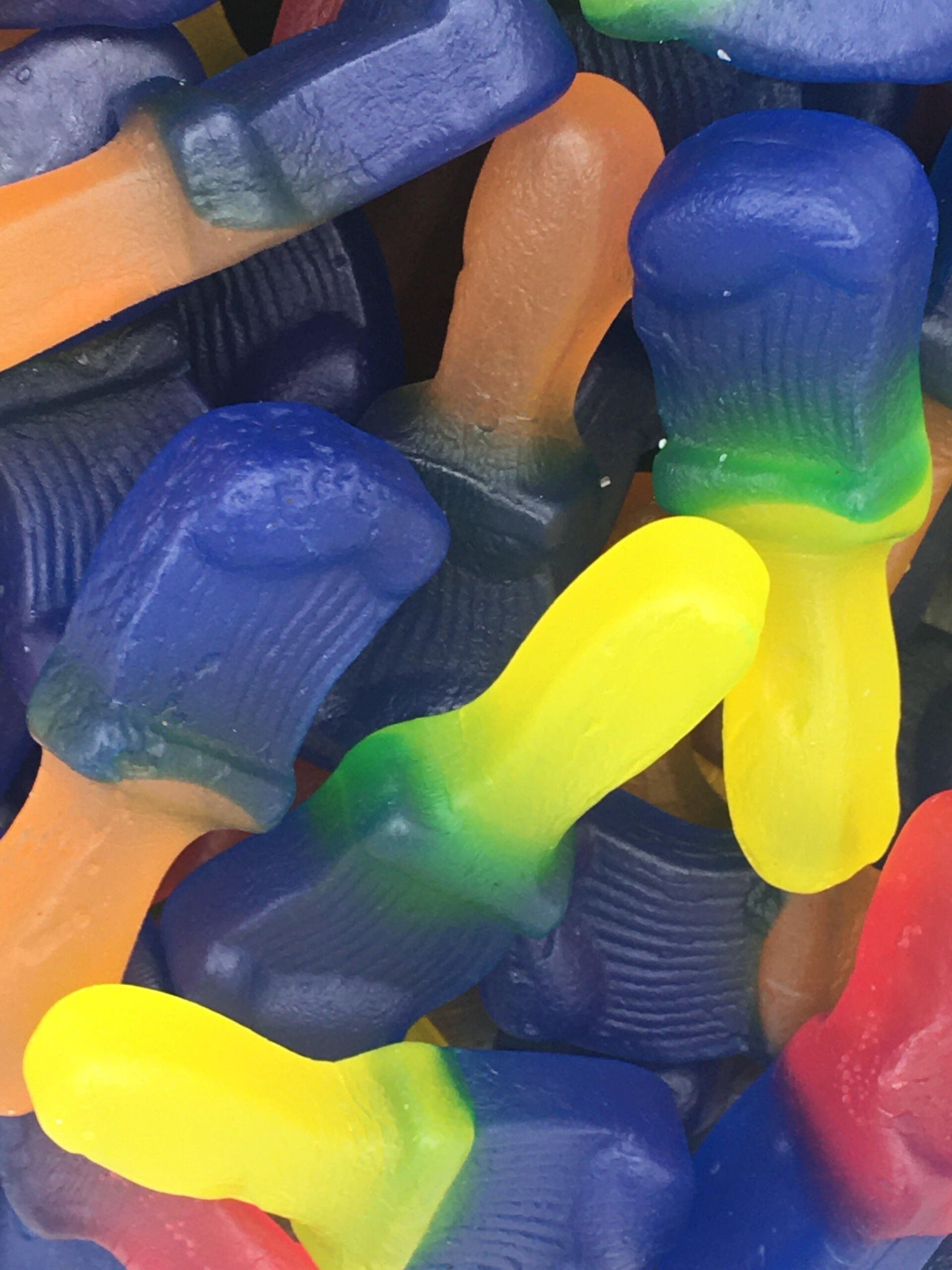 A close up of a pile of colorful gummy mushrooms