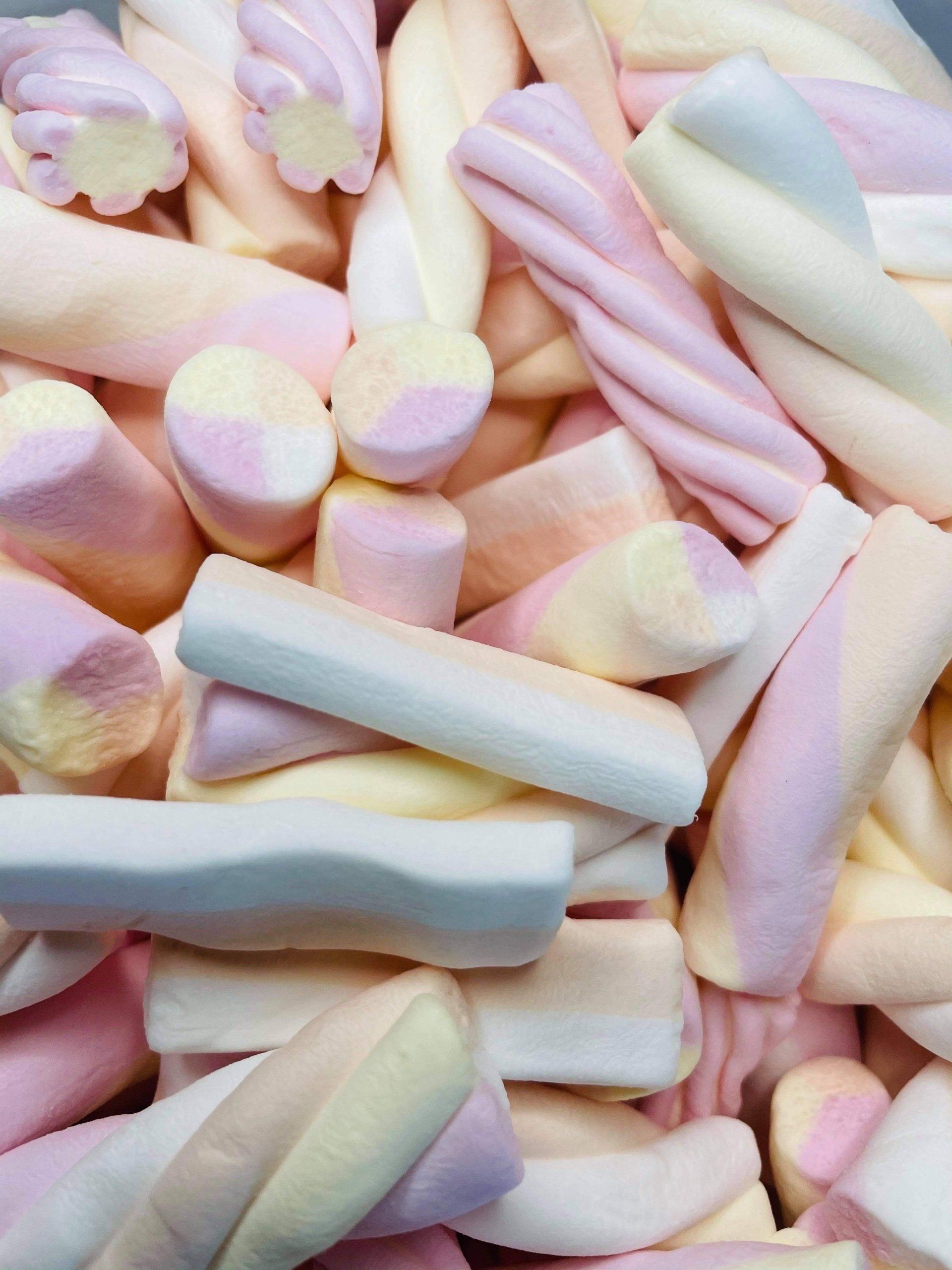 A pile of pink white and yellow marshmallows