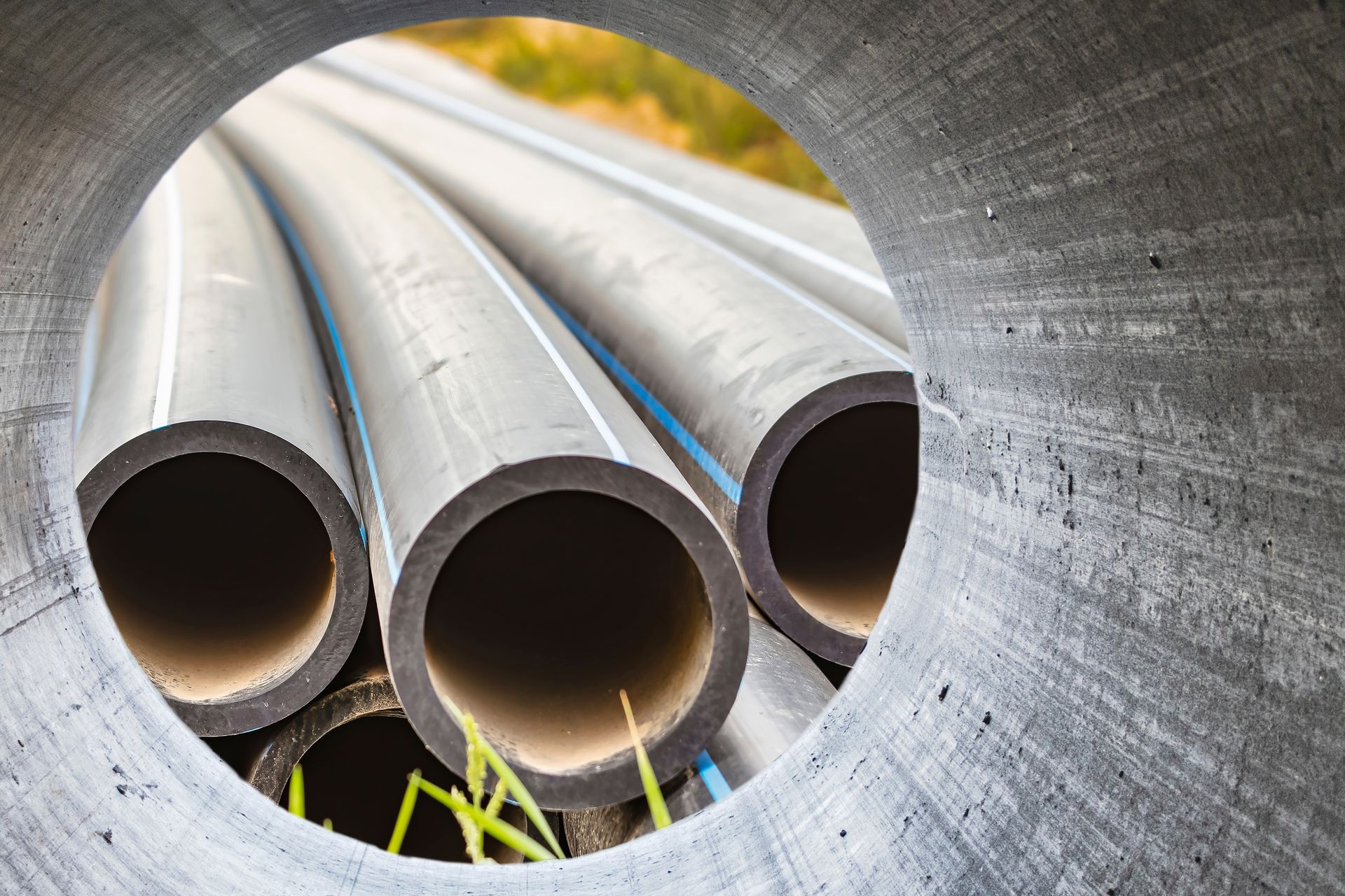 A bunch of pipes are stacked on top of each other