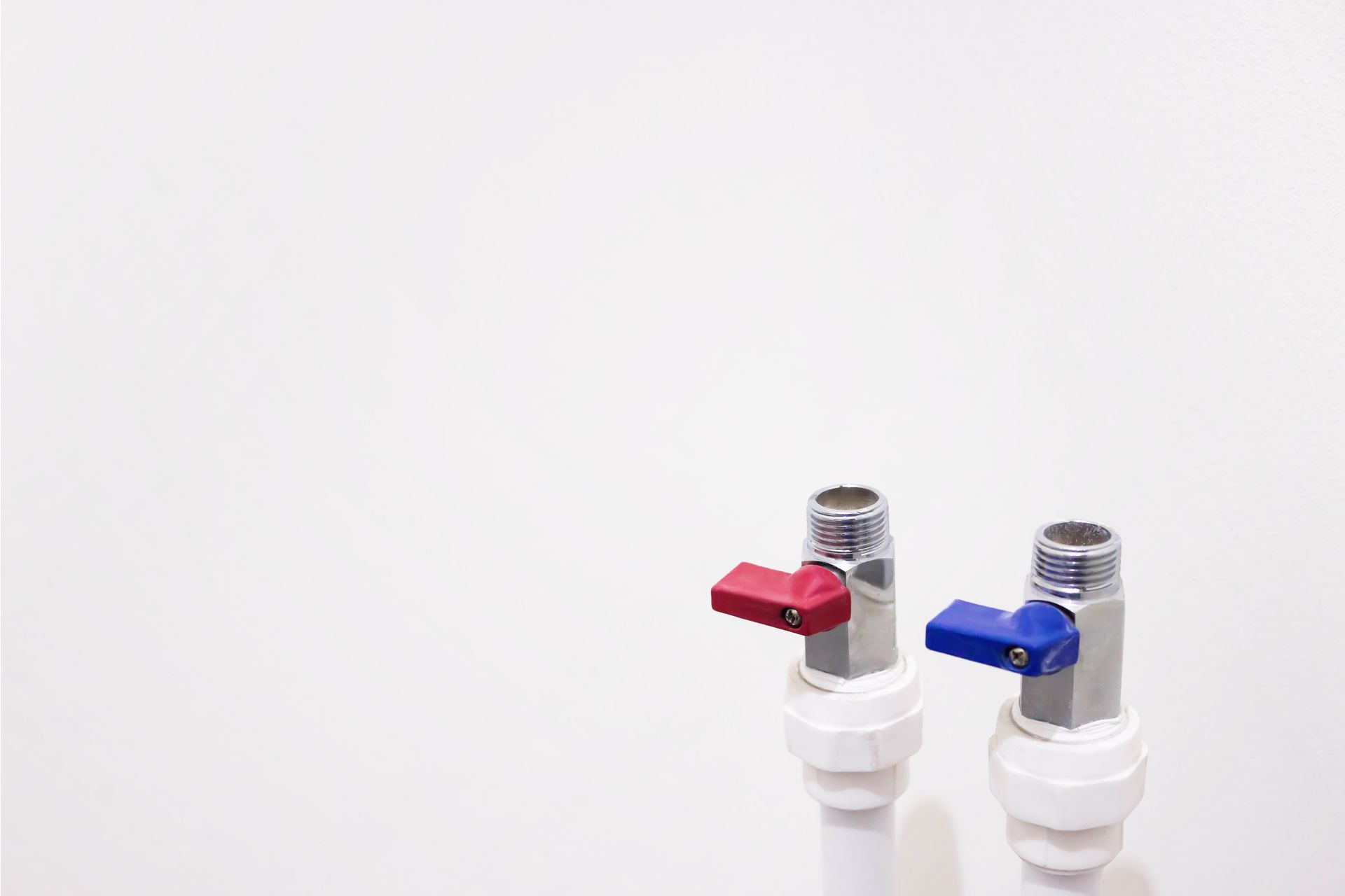 Two water valves with red and blue handles on a white background.