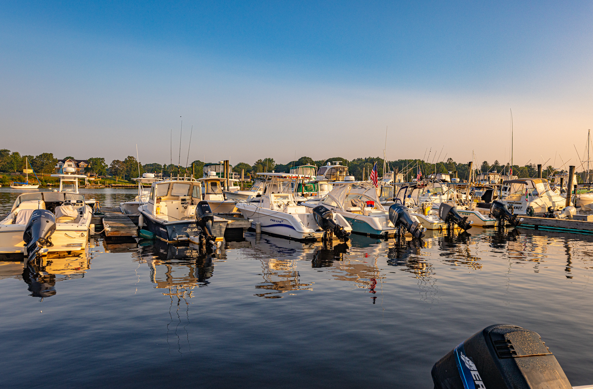 A bunch of boats are docked in a marina.