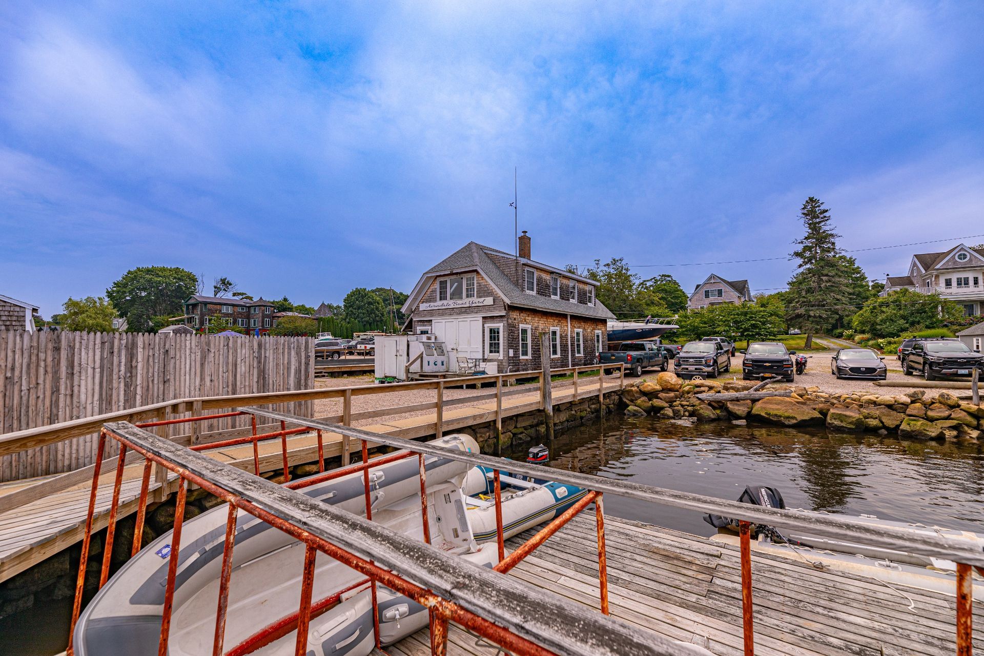 A boat is docked at a dock next to a house.