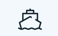 A boat is floating on top of a body of water.