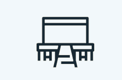 A line drawing of a table and chairs on a white background.