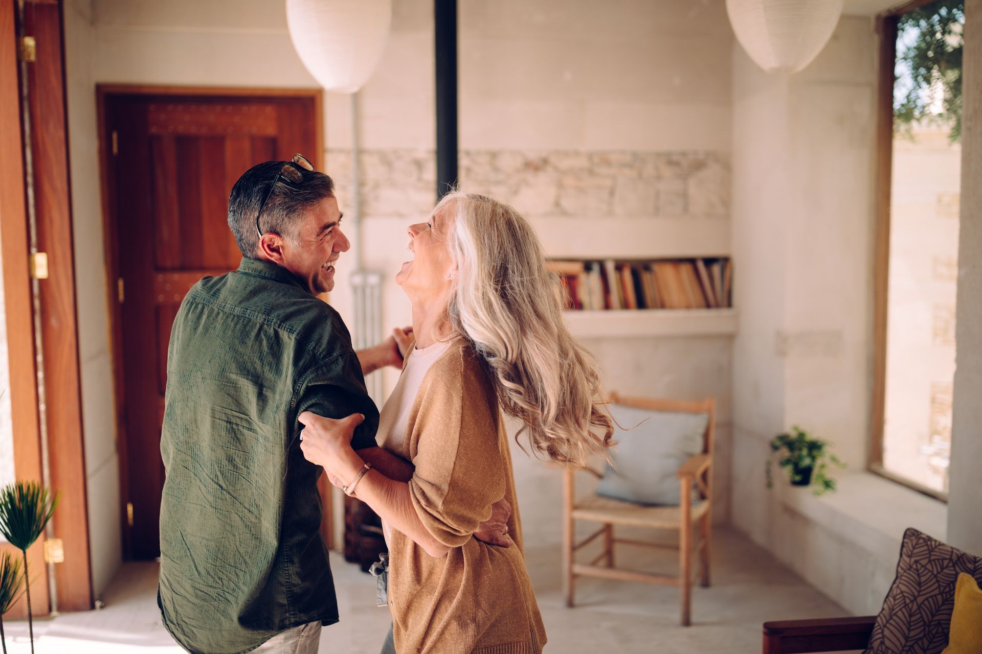 Couple dancing together at home