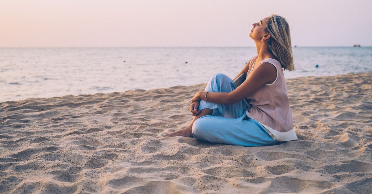woman relaxing on Carolina Beach