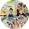 a woman and two children are sitting next to each other in a circle .