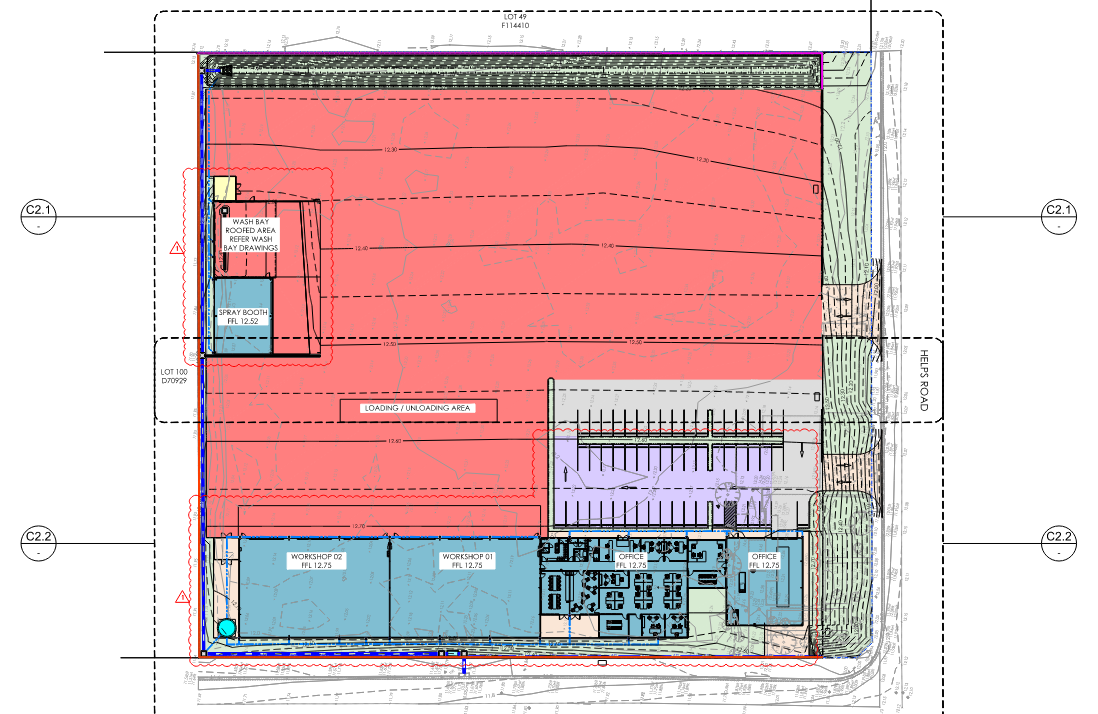 Site plan blueprint with a large red shaded area and blue utility/parking sections around the edges