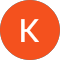 The letter k is in an orange circle on a white background.