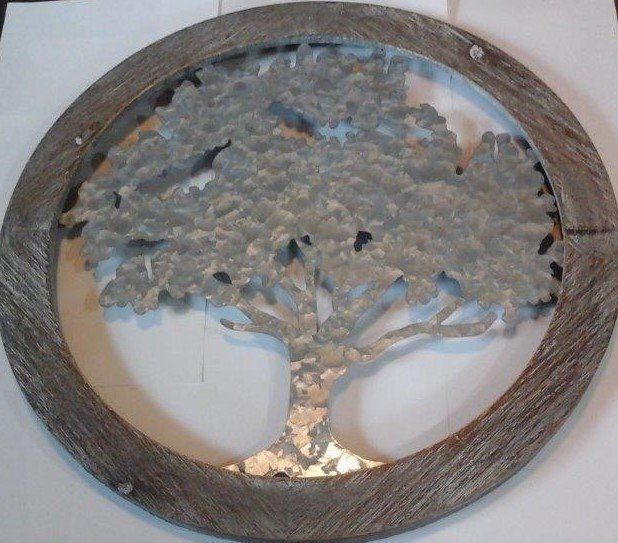A picture of a tree in a wooden frame