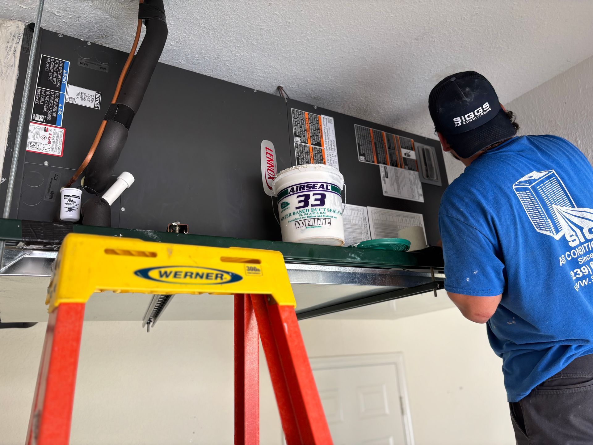 Siggs technician attaching new plenum to AHU