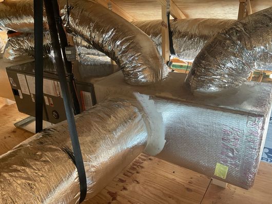 Siggs technician repairing AC