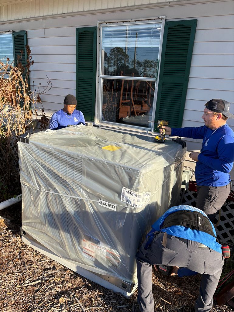 Siggs technicians installing new AC package unit