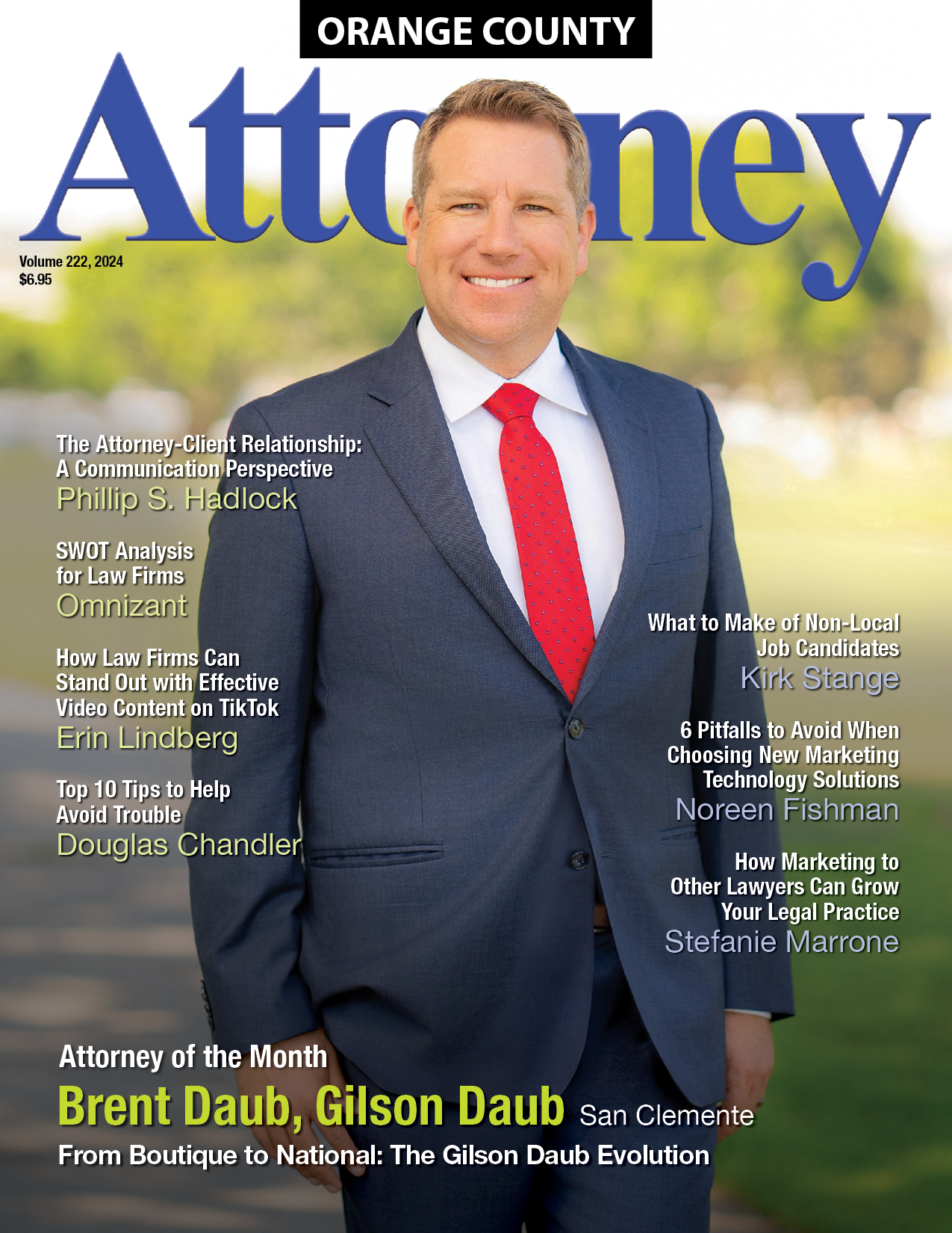 A man in a suit and red tie is on the cover of an orange county attorney magazine