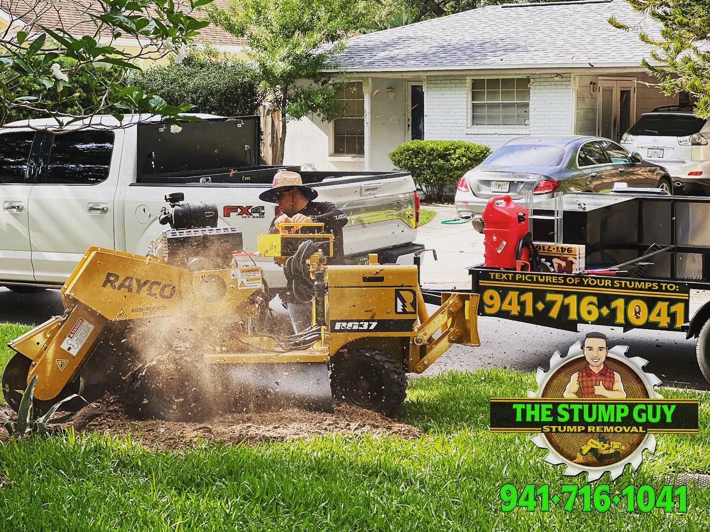 Man operating a yellow stump grinder, removing a tree stump near a house.