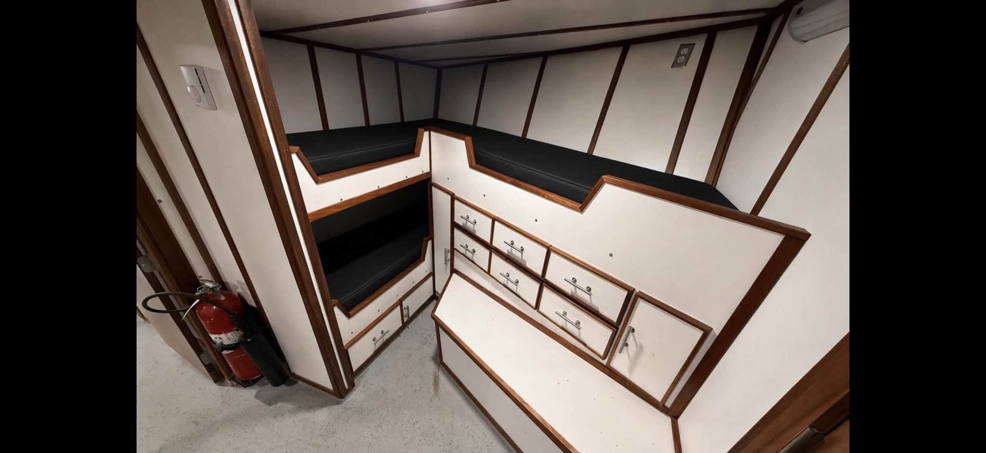 Empty white-and-brown office cubicles viewed from above in a modern interior