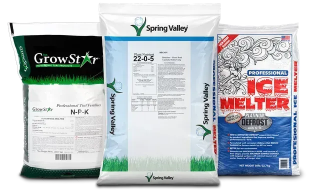 Three fertilizer and ice melt bags: green GrowStar, white Spring Valley, and blue ice melter packages.