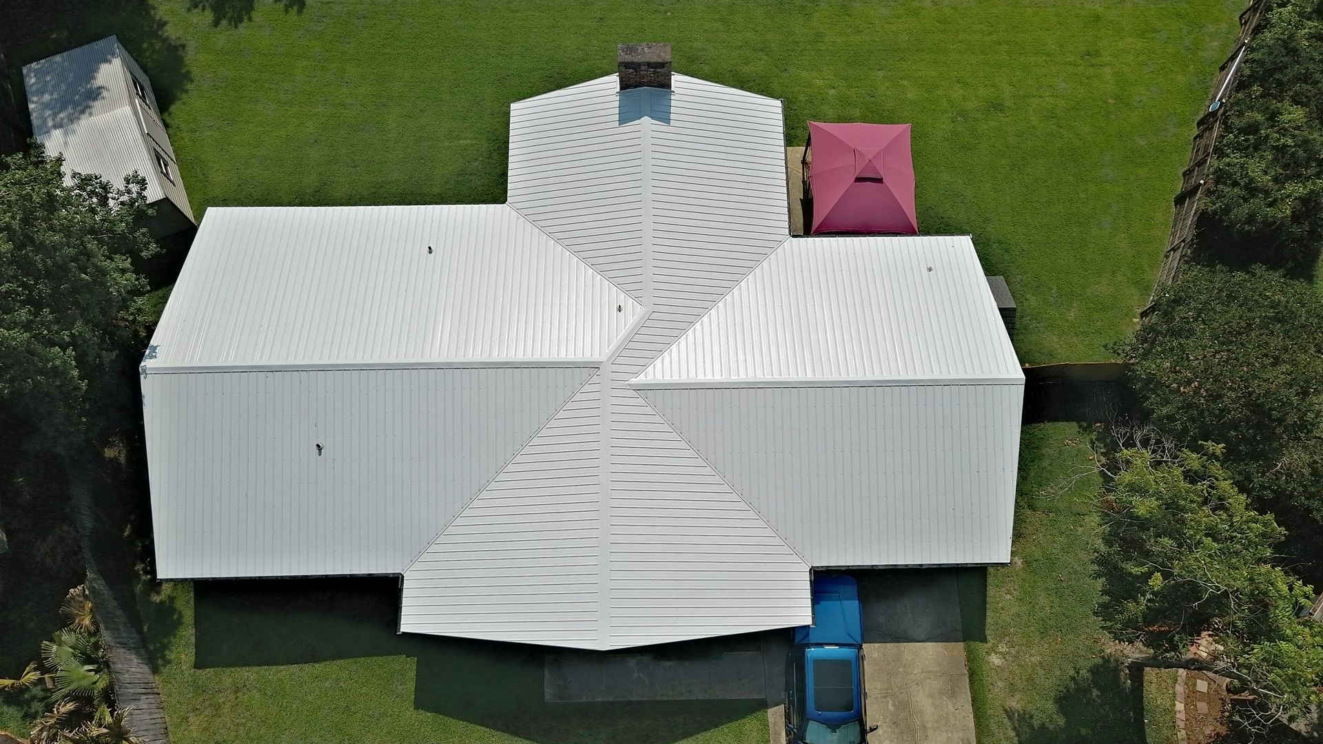 Finished white metal roof aerial view by Highmark Roofing Partners