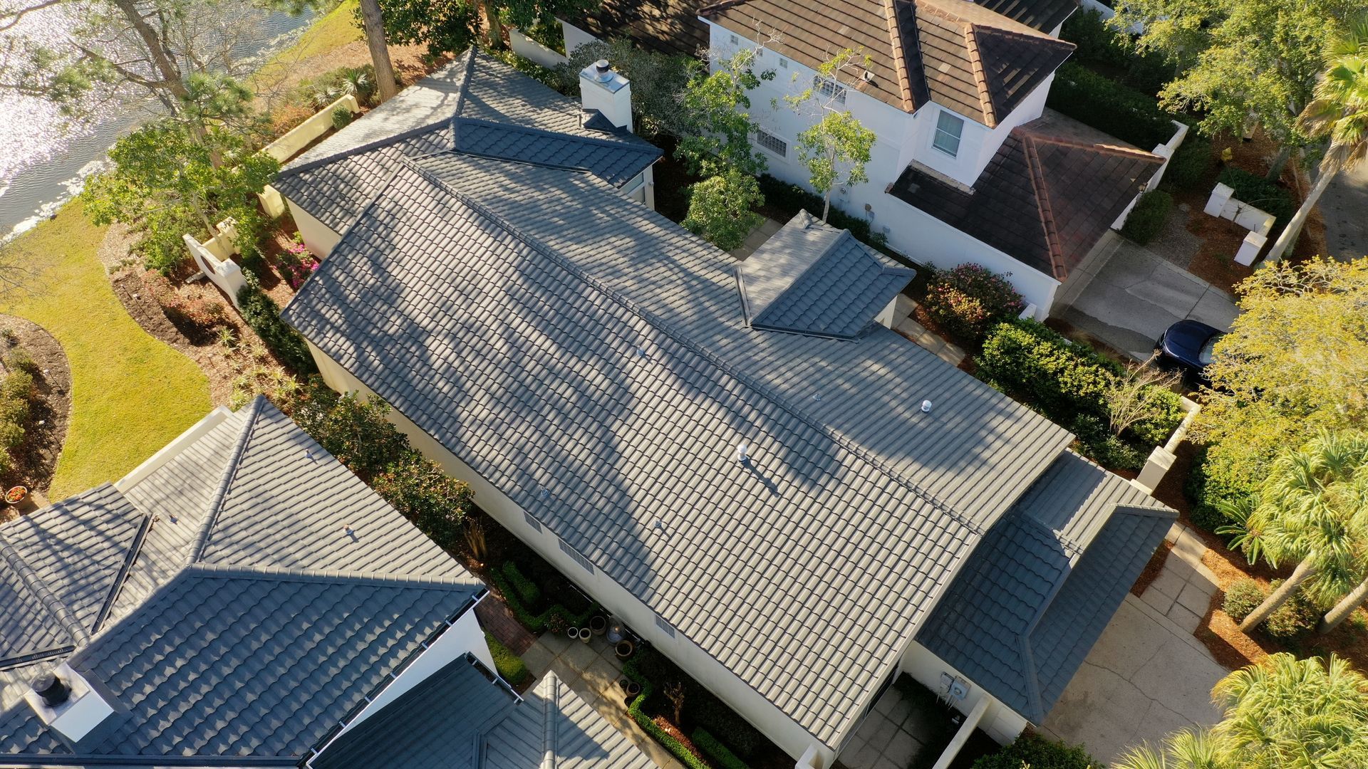 Finished residential metal roof aerial view by Highmark Roofing Partners
