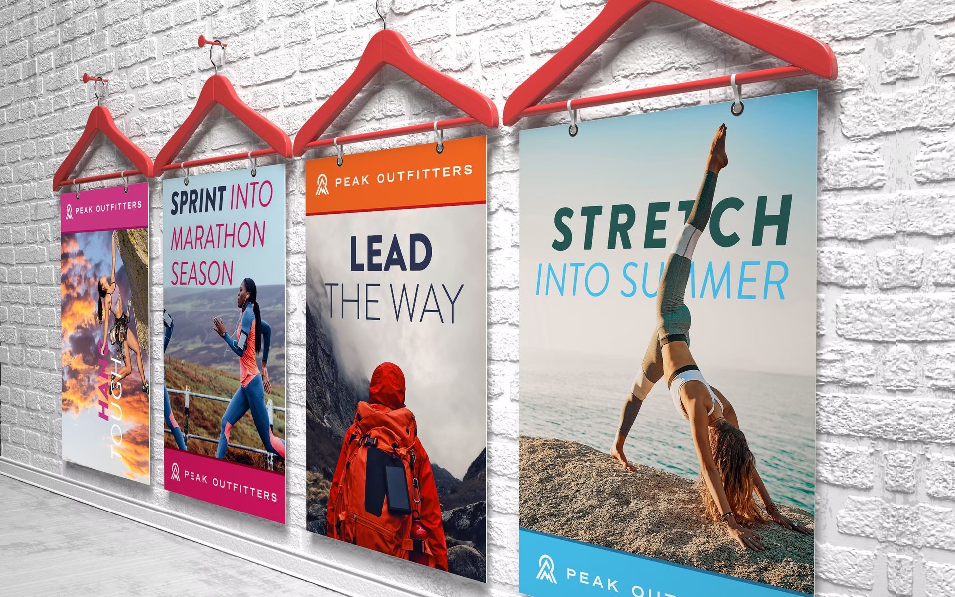 Four colorful banners hanging on a brick wall: "SPRUCE INTO MARATHON SEASON", "LEAD THE WAY", "STRETCH INTO SUMMER".