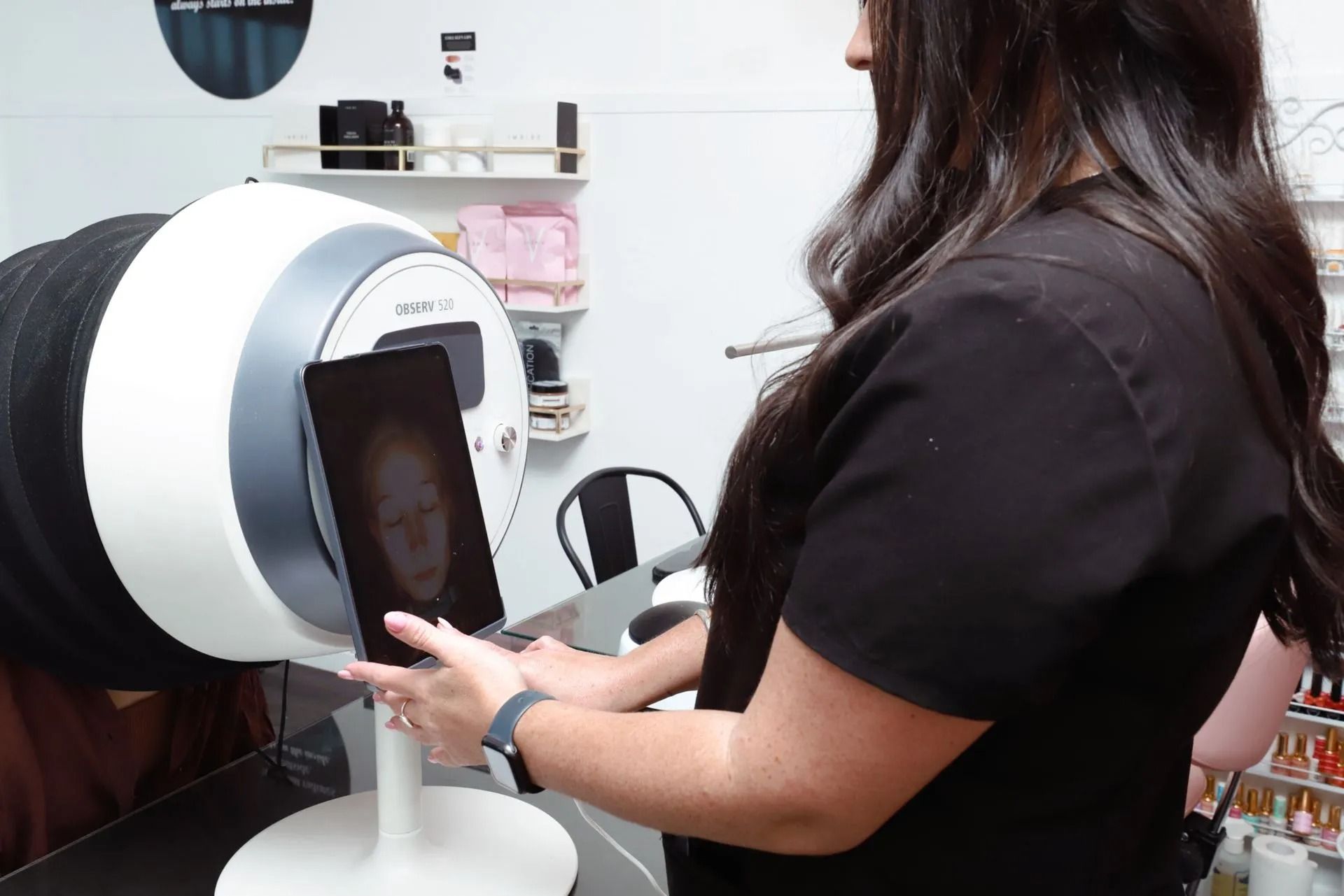 Woman Holding a Tablet Displaying a Face Scan — Vanity Skin and Beauty Forster in Forster, NSW