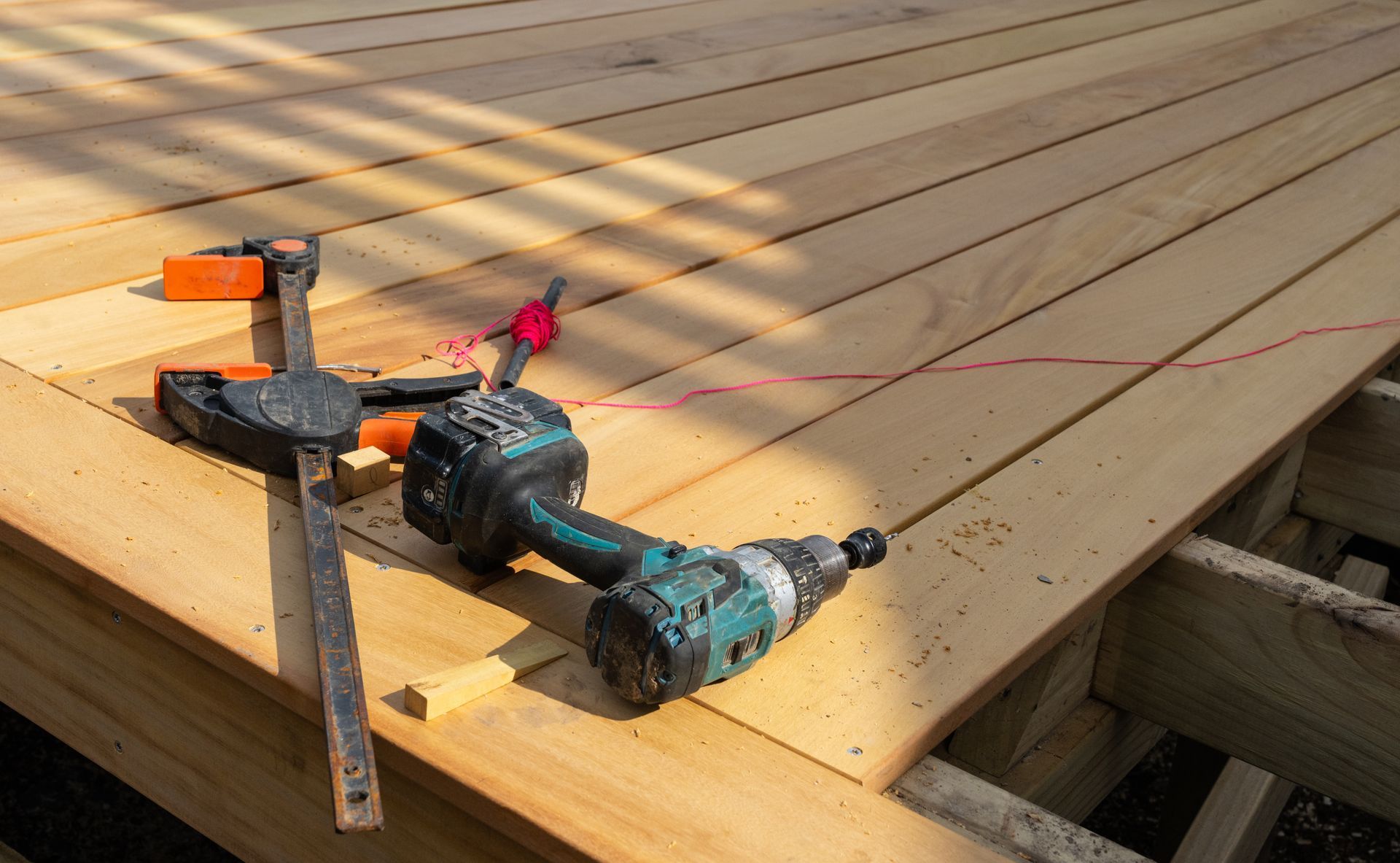 A man is working on the roof of a house.