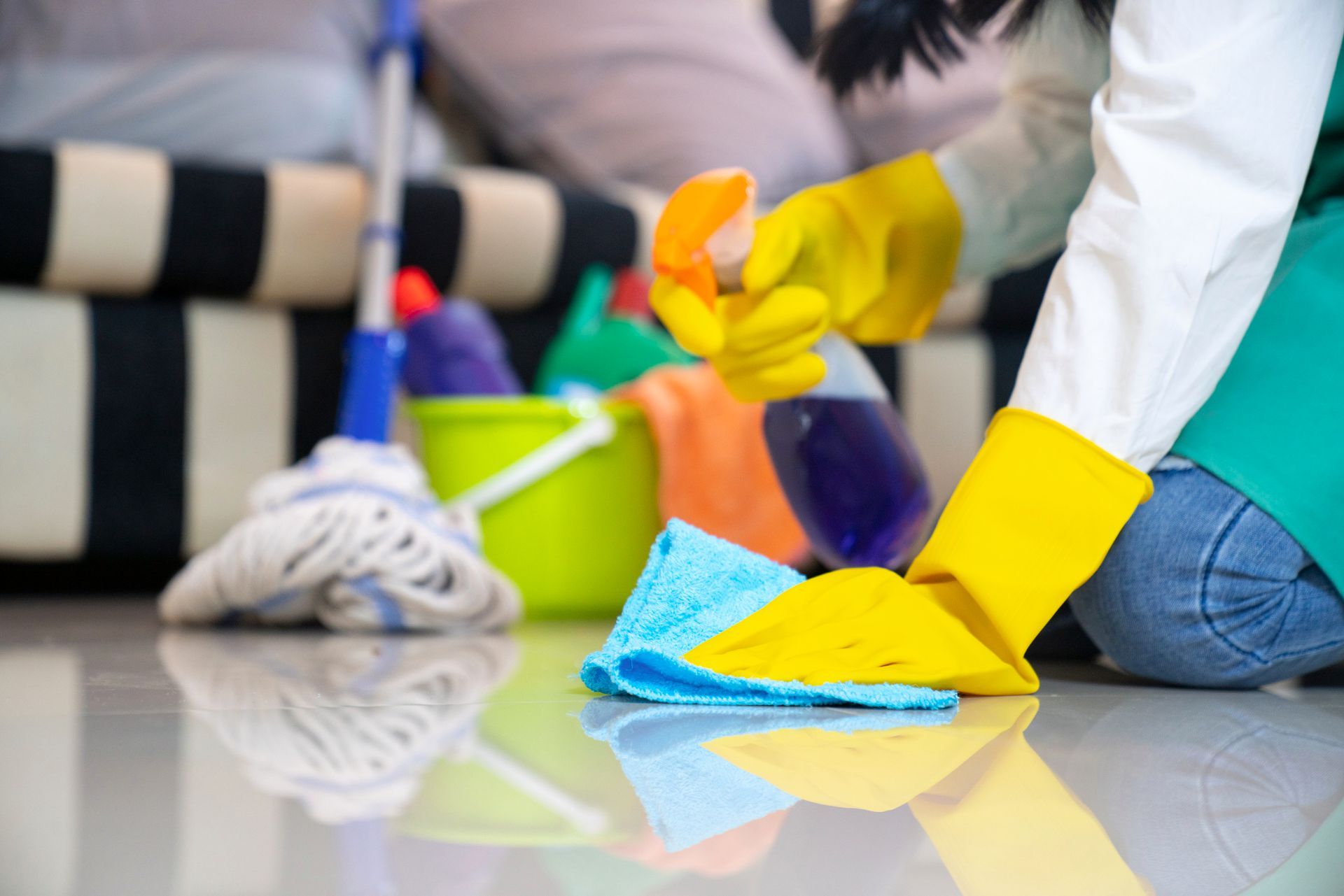 A Person in Blue Rubber Gloves Wiping Dust Using a Spray | Darch, Wa | Twin Cleaning Group