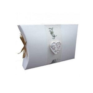 White folded gift box with a heart-shaped floral embellishment and tied ribbon