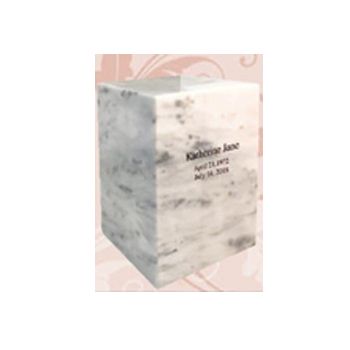 Marble funeral urn with engraved name and dates on a pink patterned background