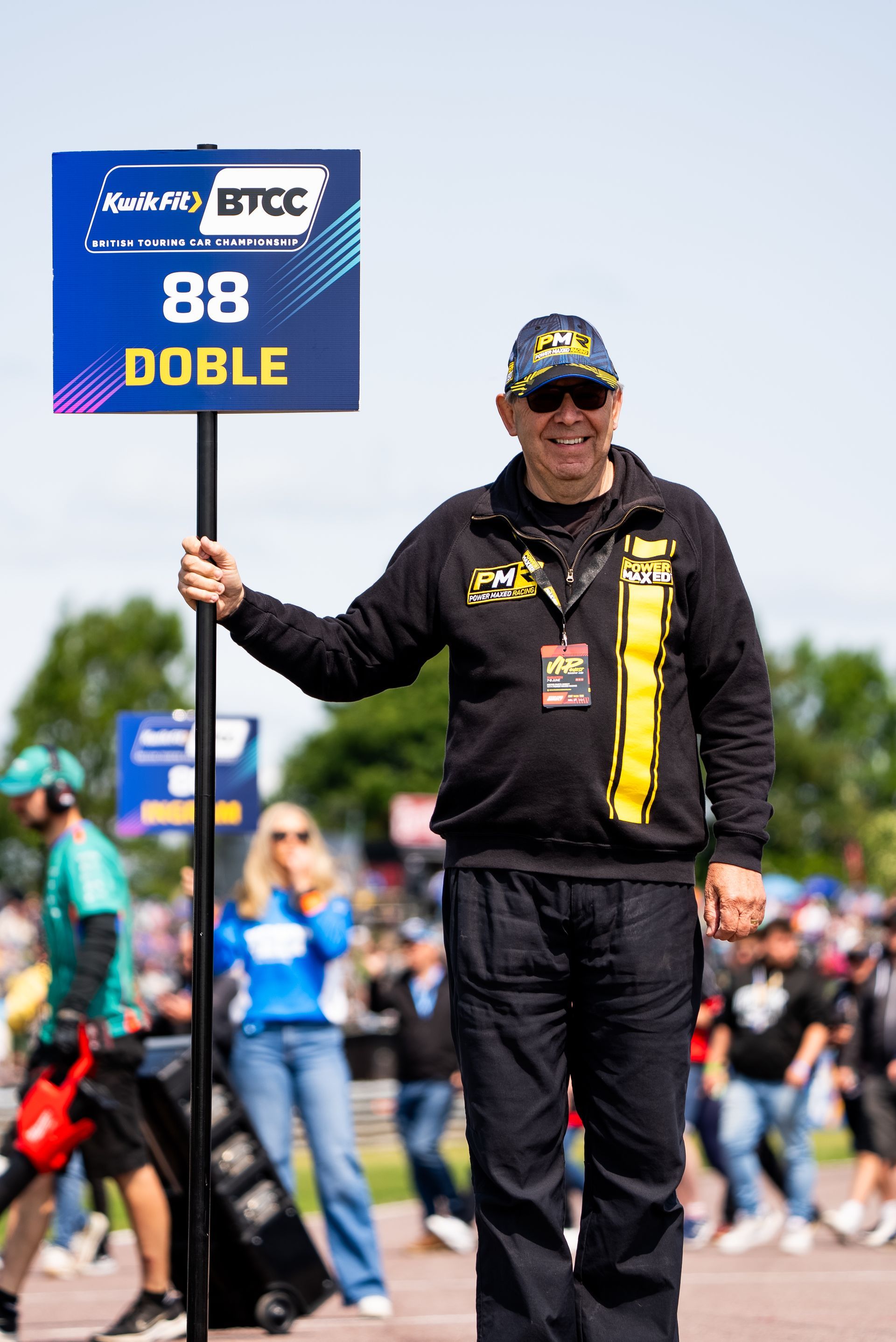 PMR fan holding up Mikey Doble's 88 Sign on Grid before Thruxton BTCC 2025