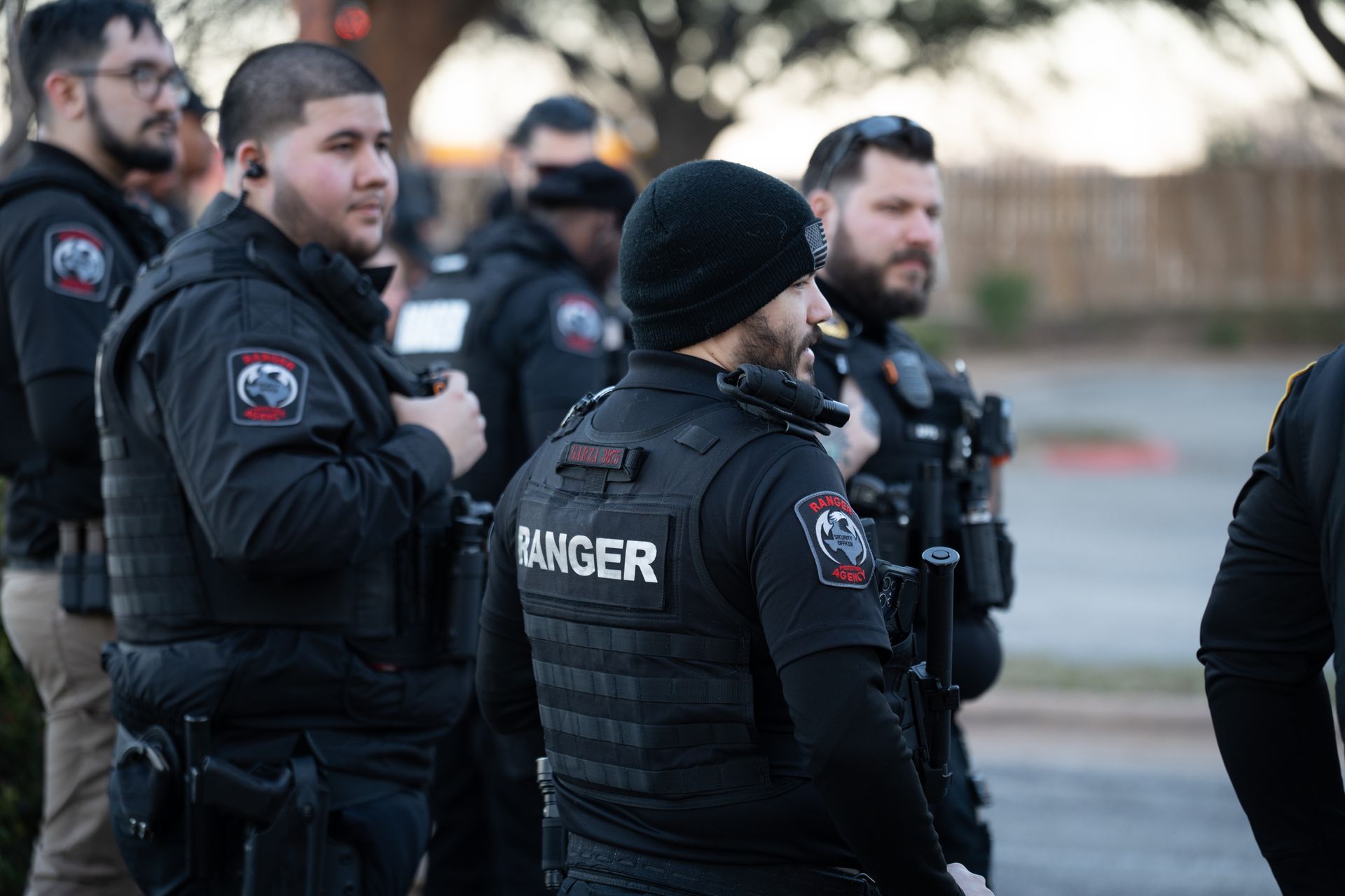 A man wearing a black vest with the word ranger on it